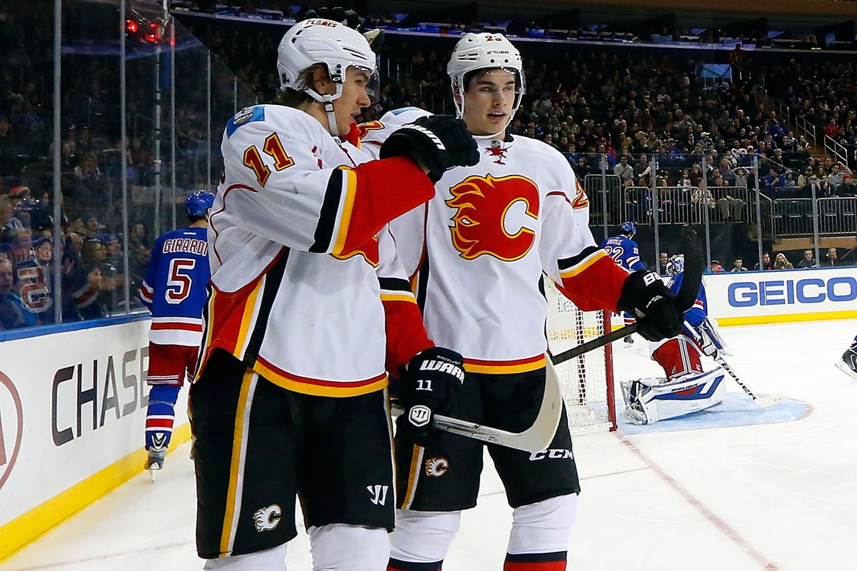 Backlund and Monahan played against each other today, so they weren't wearing the same uniform.