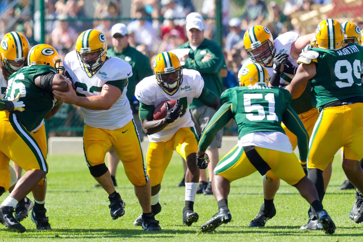 July 28, 2012; Green Bay, WI, USA; Green Bay Packers running back James Starks (44) rushes with the football during training camp practice at Ray Nitschke Field in Green Bay, WI. Mandatory Credit: Jeff Hanisch-US PRESSWIRE