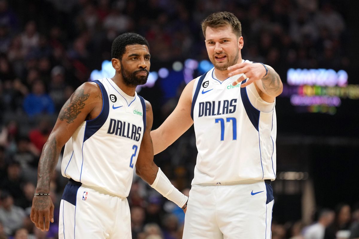 Dallas Mavericks guard Kyrie Irving (2) and guard Luka Doncic (77) talk during the first quarter against the Sacramento Kings at Golden 1 Center.