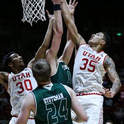 Utah Utes forward Kyle Kuzma (35) puts the ball in during the game against the Utah Valley Wolverines at the Huntsman Center in Salt Lake City on Tuesday, Dec. 6, 2016.