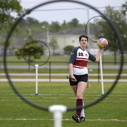 The University of Ottawa Quidditch team's Marilyn Tourangeau takes a shot at the goal while warming up before a scrimmage against the Silicon Valley Skrewts at the Quidditch World Cup in Kissimmee, Fla., Friday, April 12, 2013.  Quidditch is a game born within the pages of Harry Potter novels, but in recent years it's become a real-life sport.  The game is a co-ed, full contact sport that combines elements of rugby, dodgeball and Olympic handball. 
