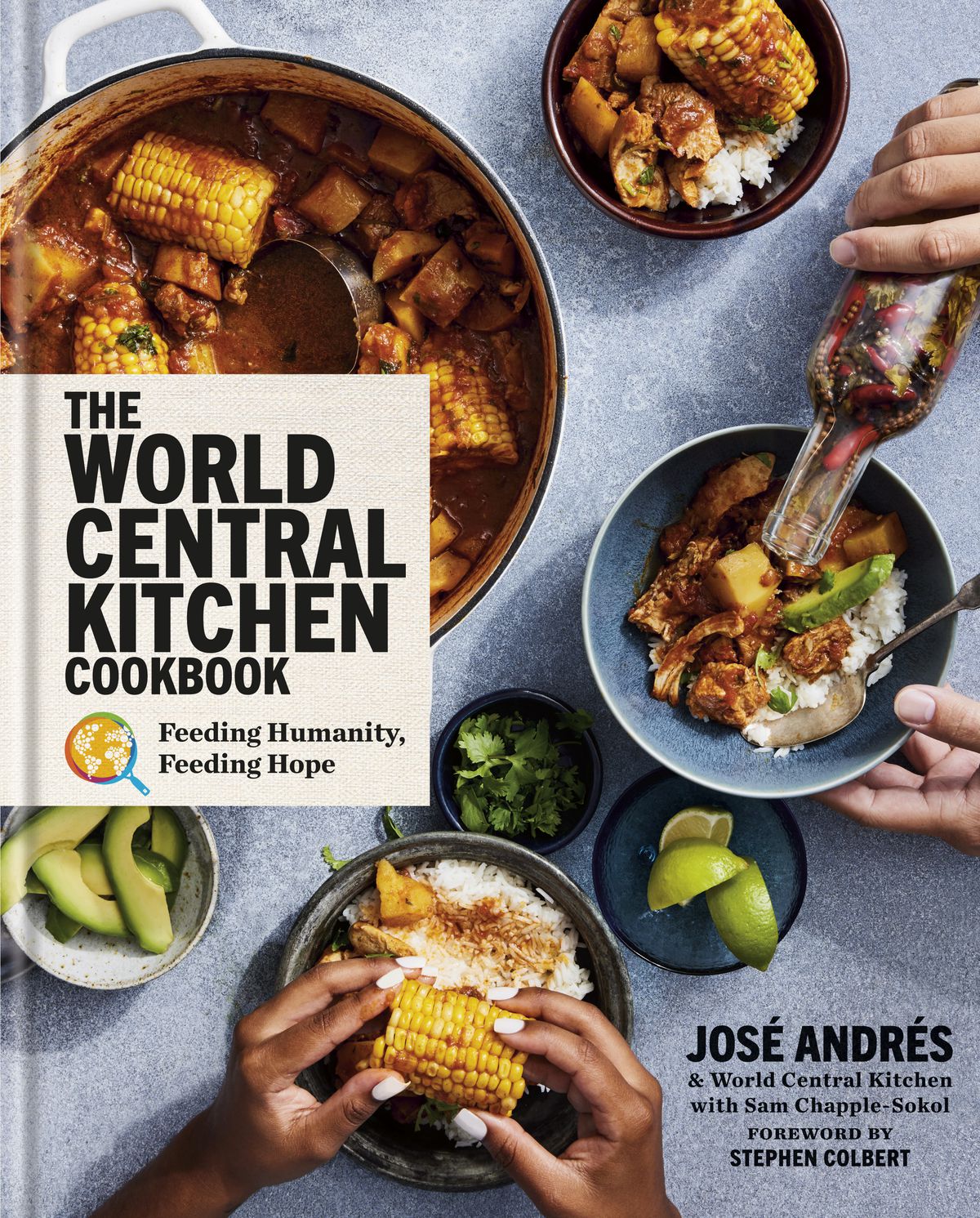 A cookbook cover with the title “The World Central Kitchen Cookbook, Feeding Humanity, Feeding Hope” and author text of “Jose Andres &amp; World Central Kitchen with Sam Chapple-Sokel, Foreword by Stephen Colbert” and images of plated foods.