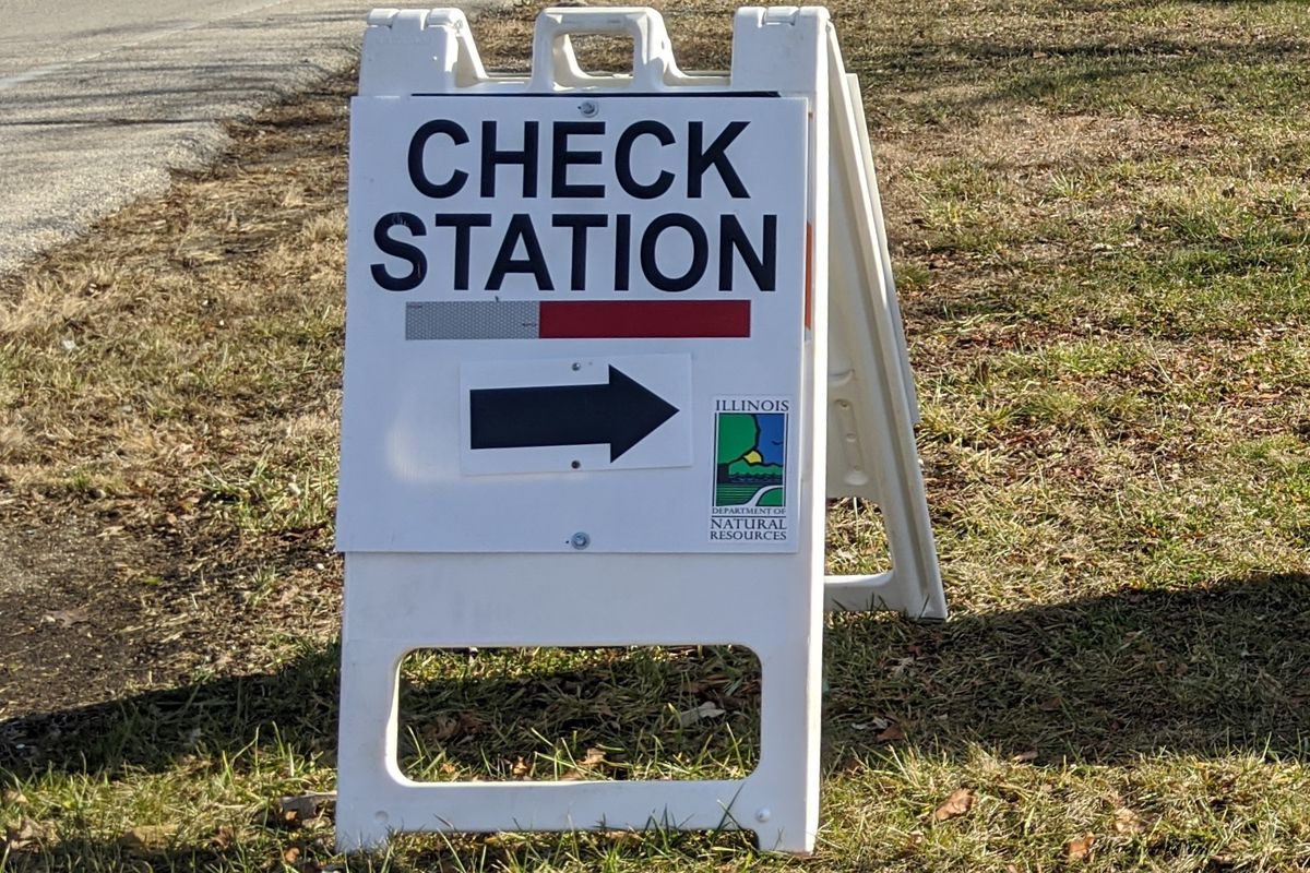 File photo of a sign for a deer check station. Credit: Dale Bowman