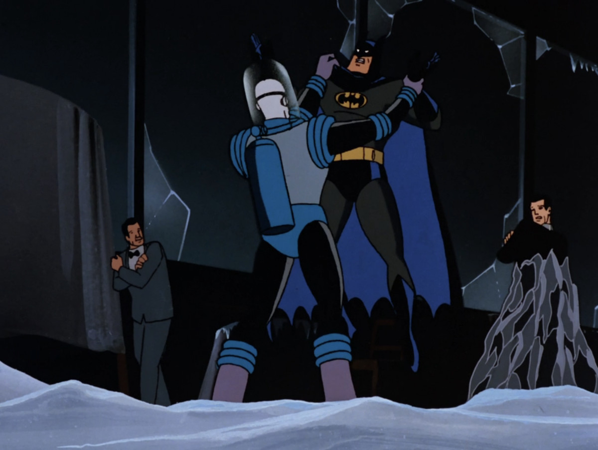 Mr. Freeze holds up Batman by the cape in a still from Batman: The Animated Series