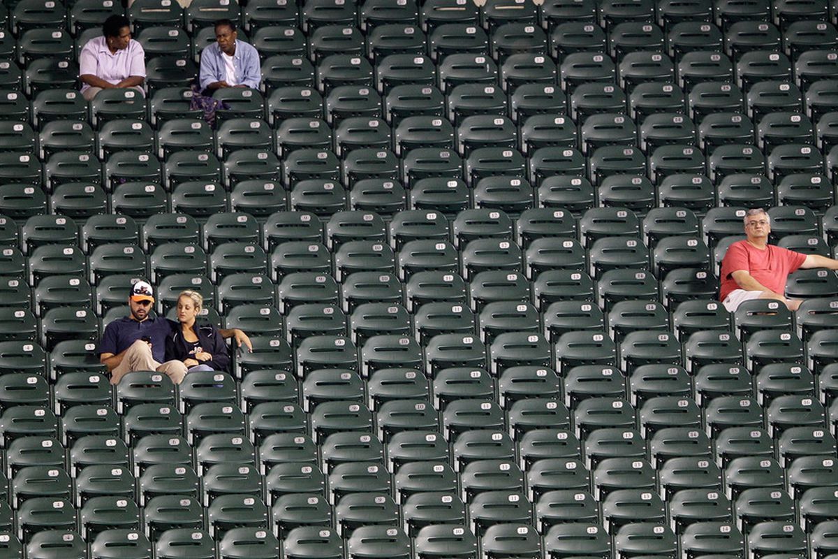 BALTIMORE, MD - SEPTEMBER 12: Fans watch the eighth inning from the seats in the outfield during the Baltimore Orioles and Tampa Bay Rays game at Oriole Park at Camden Yards on September 12, 2011.