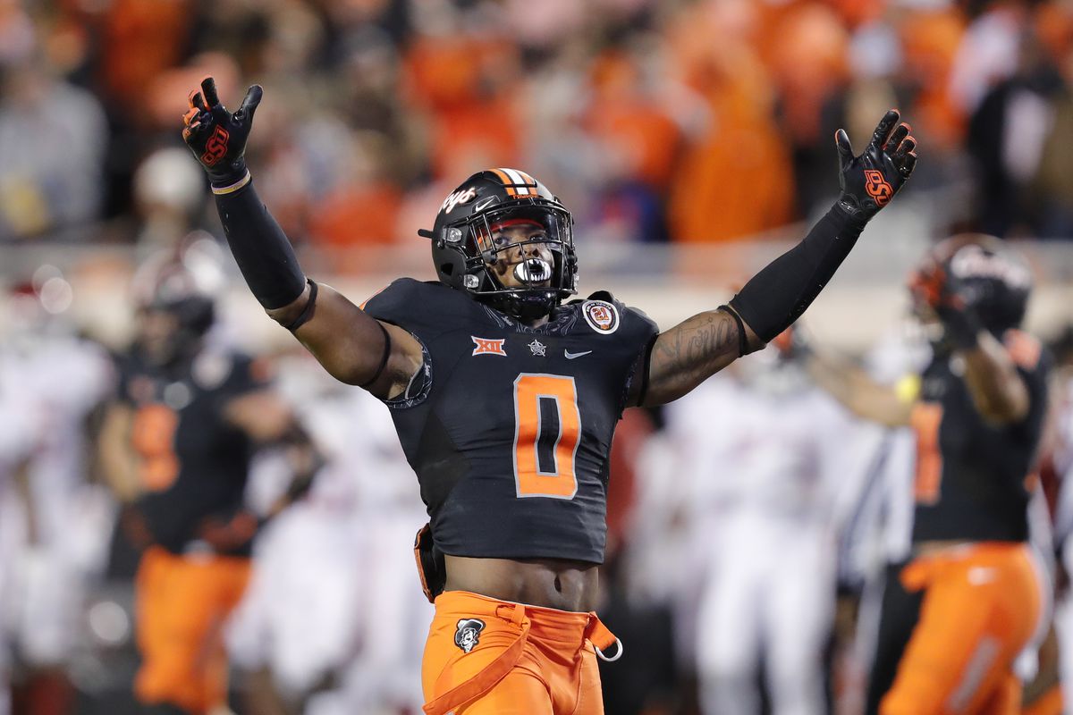Oklahoma State Cowboys cornerback Christian Holmes celebrates after an Oklahoma Sooners tackle during the second half at Boone Pickens Stadium.