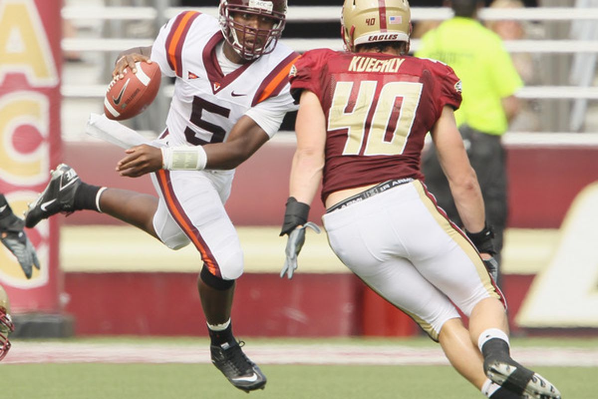 Tyrod Taylor #5 of the Virginia Tech Hokies scrambles with the ball as Luke Kuechly #40 of the Boston College Eagles defends on September 25 2010 at Alumni Stadium in Chestnut Hill Massachusetts.  (Photo by Elsa/Getty Images)