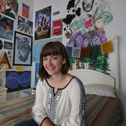 Alexandra Allen poses in front of the mural she drew in her bedroom at home, Friday, April 3, 2015, in Mapleton. She is one of 34 people in the world known to have the very rare and hardly understood condition, aquagenic urticaria, which causes her skin to break out in a swollen, itchy rash whenever it is exposed to water.