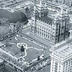 Aerial view of Temple Square in the 1930s shows the navigational sign painted on the roof of the Tabernacle to help pilots find the city's airport.