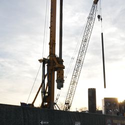 Steel beam still suspended in midair over the triangle lot