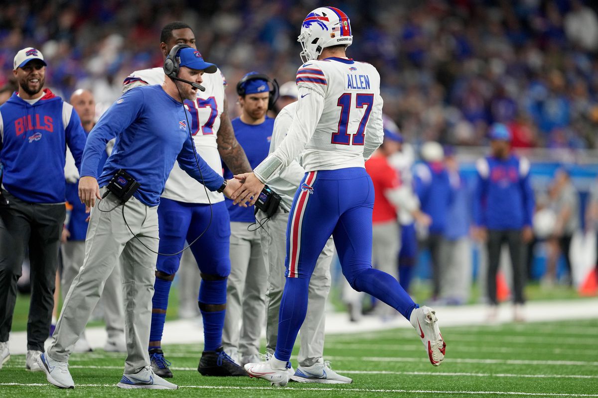 Head coach Sean McDermott of the Buffalo Bills high fives Josh Allen #17 after scoring a touchdown against the Detroit Lions during the second quarter at Ford Field on November 24, 2022 in Detroit, Michigan.