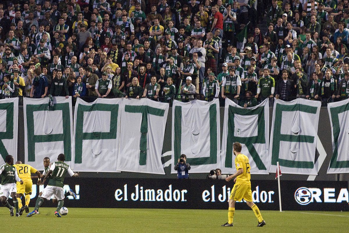 PORTLAND, OR - MAY 21: Members of the Portland Timbers and the Columbus Crew play in front of a sign hung by the 'Timbers Army' in the first half of the game at PGE Park on May 21, 2011 in Portland, Oregon. (Photo by Steve Dykes/Getty Images)