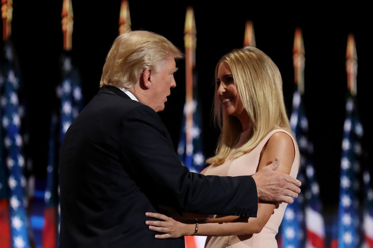 Donald Trump holding Ivanka Trump's arms