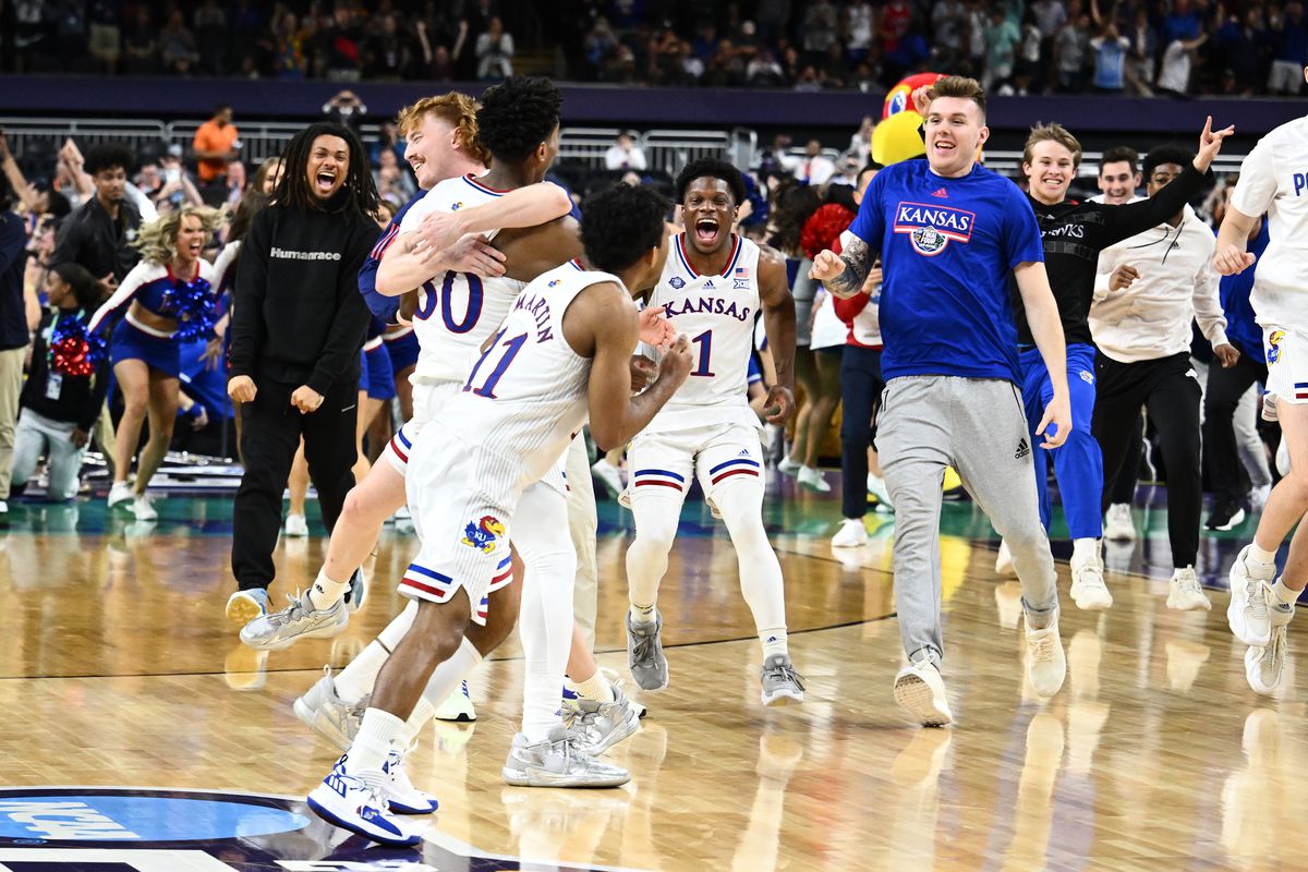 The Kansas Jayhawks celebrate after defeating the North Carolina Tar Heels during the second half of the 2022 NCAA Men’s Basketball Tournament National Championship game at Caesars Superdome on April 04, 2022 in New Orleans, Louisiana.