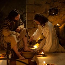 Jesus washes Peter's feet while at the Last Supper with the Apostles in this image from the Bible Videos series. 