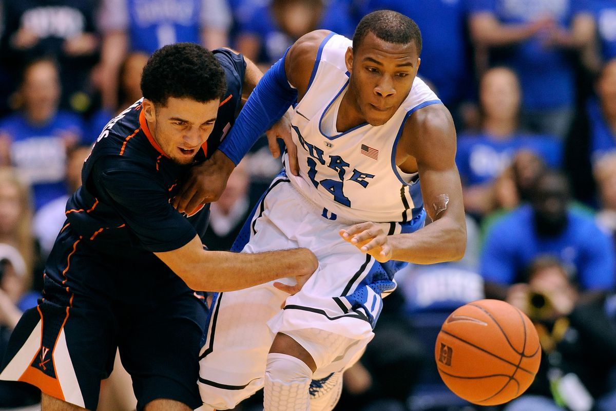 London Perrantes #23 of the Virginia Cavaliers battles for a loose ball with Rasheed Sulaimon #14 of the Duke Blue Devils during a game at Cameron Indoor Stadium