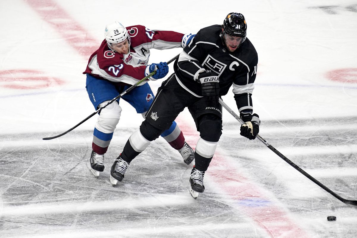 Colorado Avalanche Center Nathan MacKinnon (29) battles with Los Angeles Kings Center Anze Kopitar (11) during a National Hockey League game between the Colorado Avalanche and the Los Angeles Kings on January 21, 2021, at the Staples Center in Los Angeles, CA.