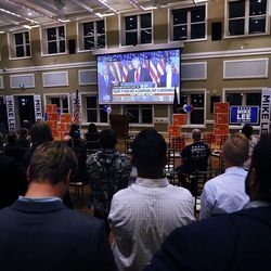 People watch a monitor during an election night party in South Jordan on Wednesday, Nov. 9, 2016, as Donald Trump won the U.S. presidential election.