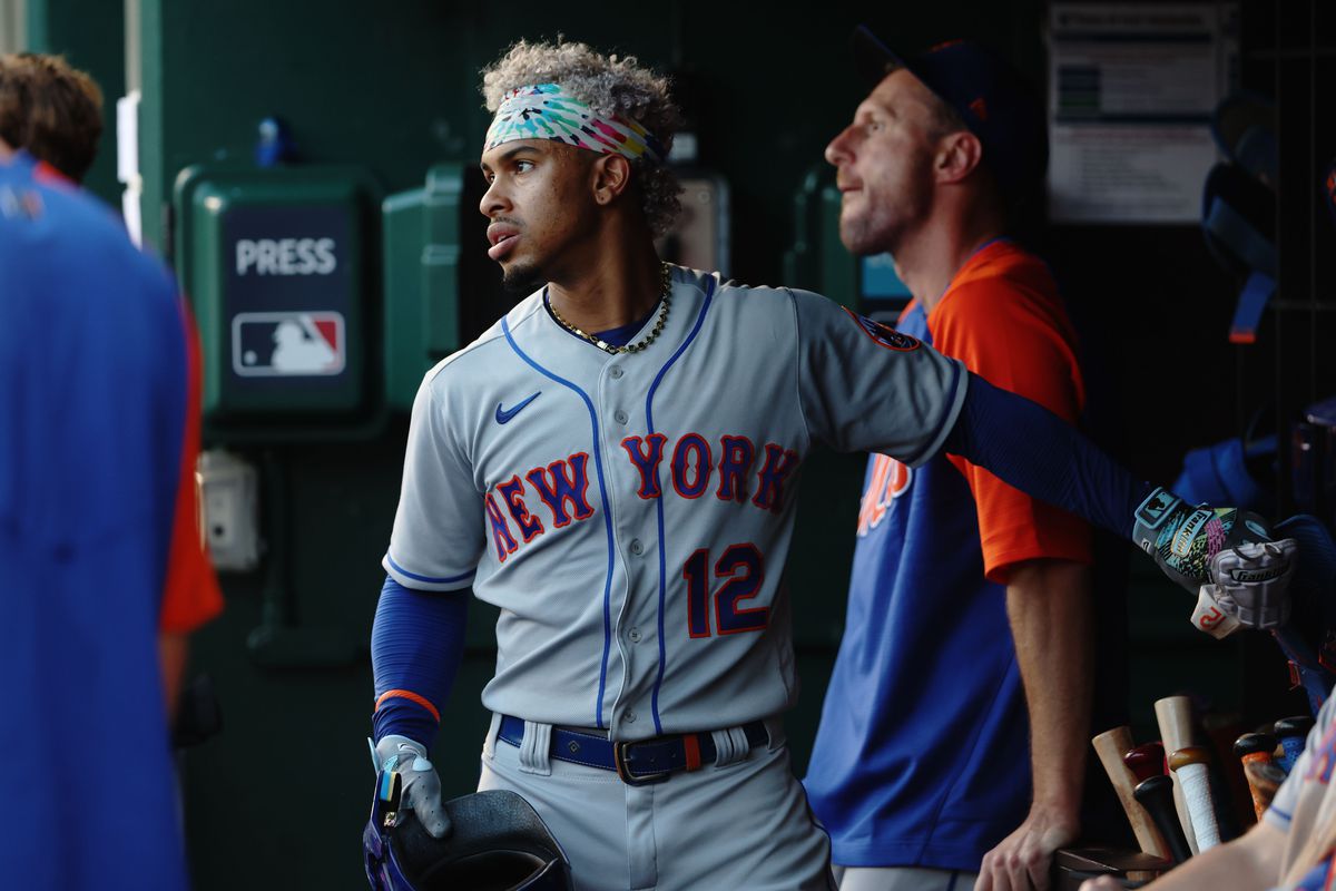 Francisco Lindor #12 of the New York Mets looks on from the dugout during the game between the New York Mets and the Washington Nationals at Nationals Park on Tuesday, August 2, 2022 in Washington, District of Columbia.