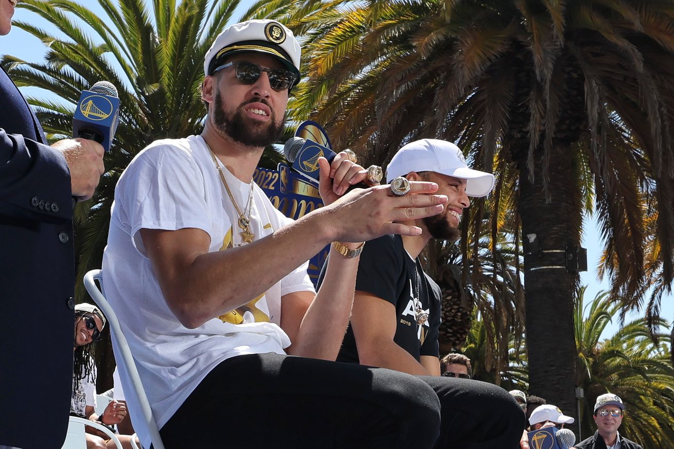Klay Thompson speaking next to Steph Curry at the Warriors parade 