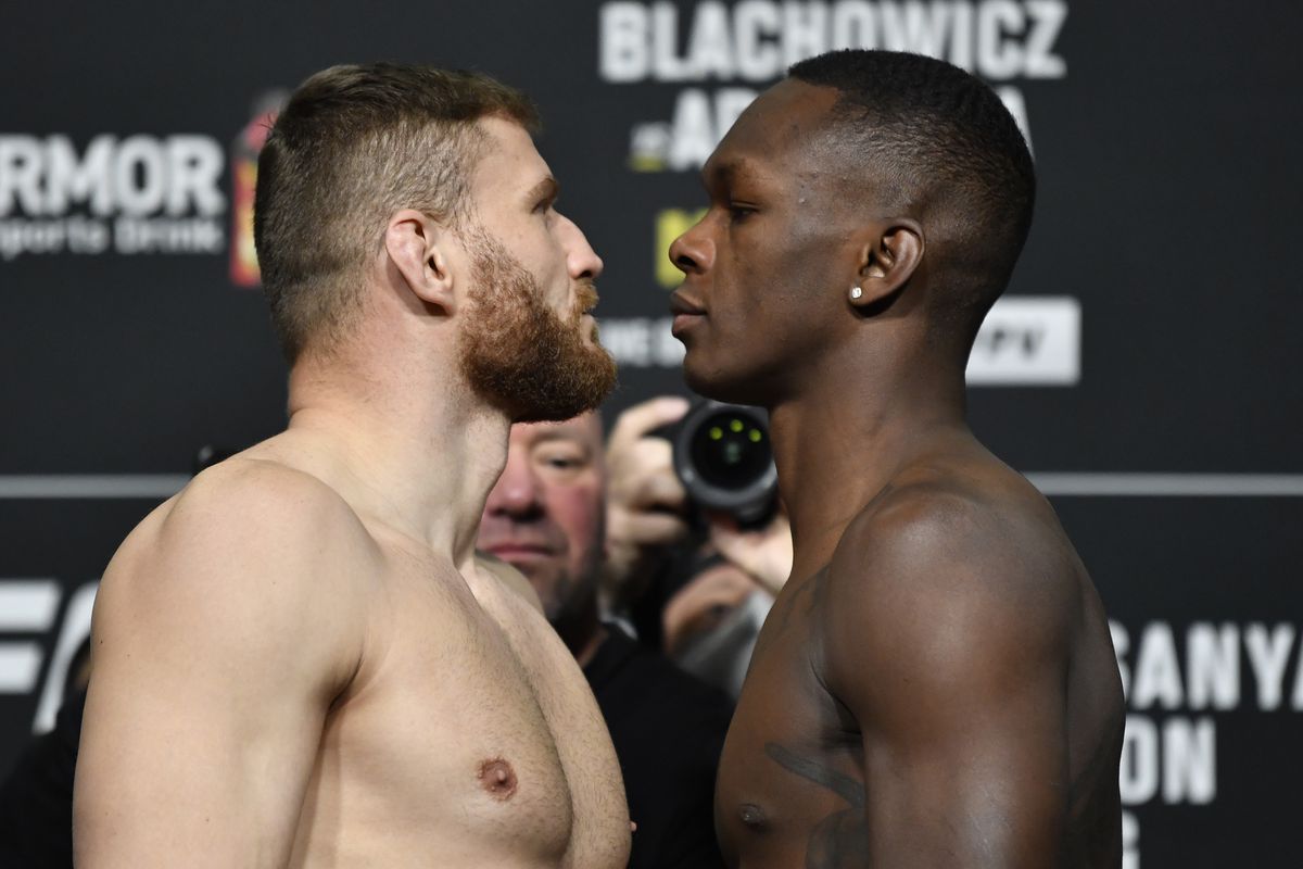 Opponents Jan Blachowicz of Poland and Israel Adesanya of Nigeria face off during the UFC 259 weigh-in at UFC APEX on March 05, 2021 in Las Vegas, Nevada.