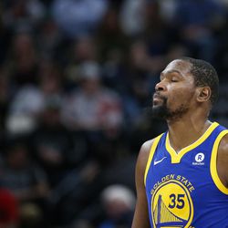 Golden State Warriors forward Kevin Durant walks down the court as the Warriors trail the Utah Jazz in the first half at Vivint Arena in Salt Lake City on Tuesday, April 10, 2018.