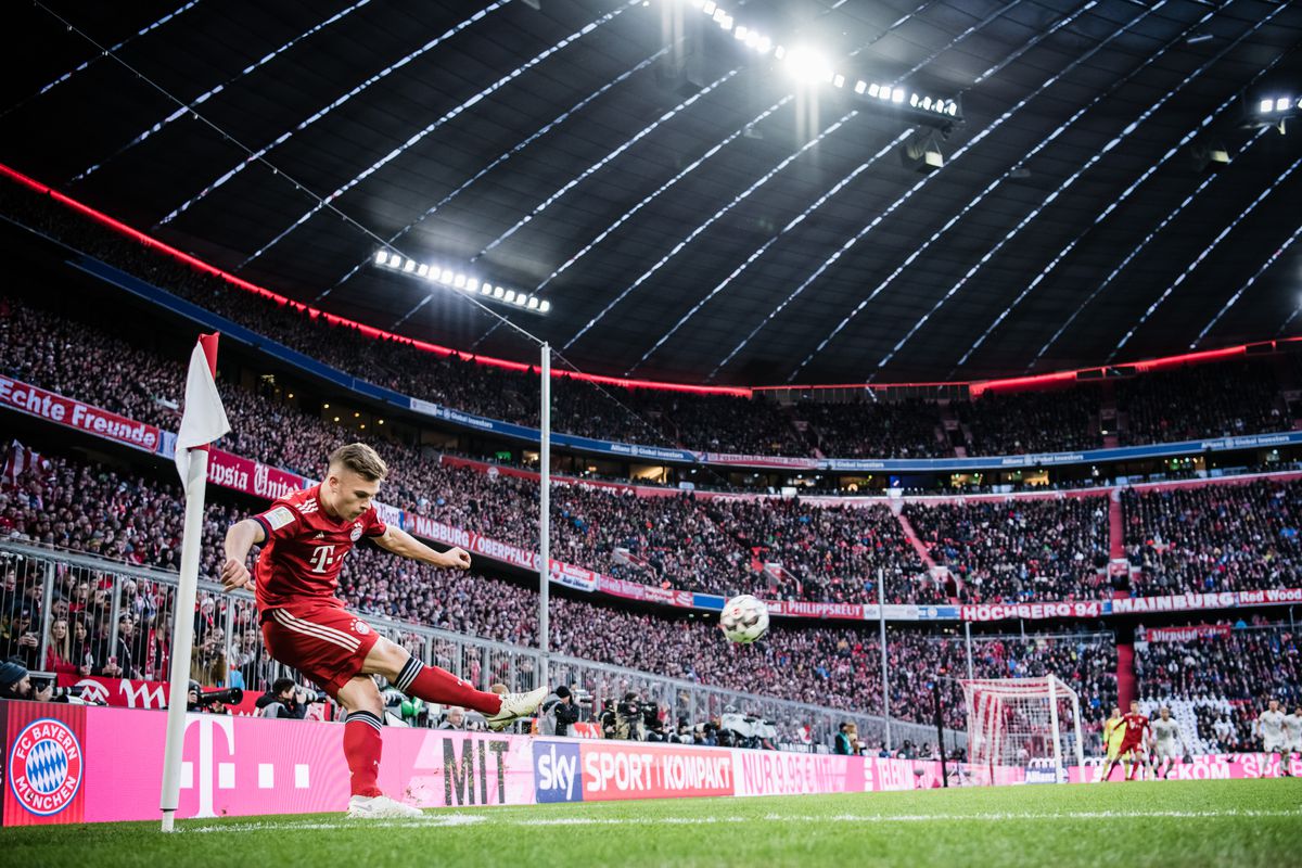 MUNICH, GERMANY - DECEMBER 08: (EDITORS NOTE: Image has been digitally enhanced.) Joshua Kimmich of Bayern Muenchen shoots a corner during the Bundesliga match between FC Bayern Muenchen and 1. FC Nuernberg at Allianz Arena on December 8, 2018 in Munich, Germany.