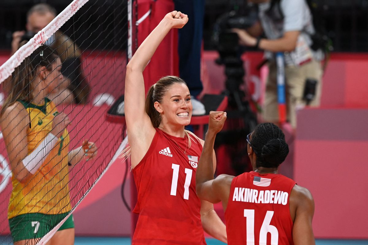 USA’s Andrea Drews and USA’s Foluke Akinradewo react after a point in the women’s gold medal volleyball match between Brazil and USA during the Tokyo 2020 Olympic Games at Ariake Arena in Tokyo on August 8, 2021.&nbsp;