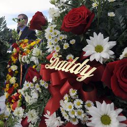 A wreath reads 'Daddy' during the interment service for Utah County Sheriff's Sgt. Cory Wride at the Spanish Fork City Cemetery on Wednesday, Feb. 5, 2014.