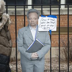 A cut out of Lori Lightfoot is taped to the fence outside of Suder elementary at 2022 W Washington Blvd in West Town, Monday, Jan. 11, 2021. 