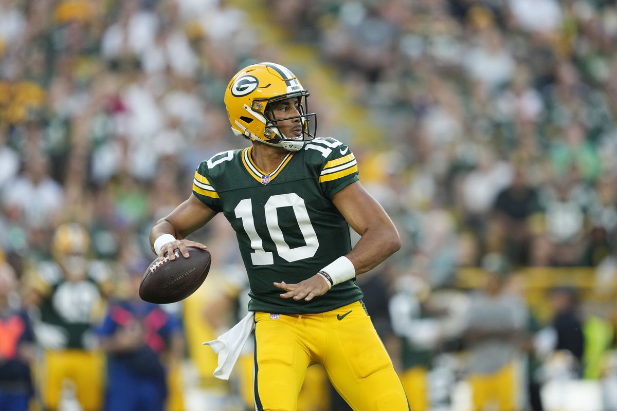 GREEN BAY, WISCONSIN - AUGUST 19: Jordan Love #10 of the Green Bay Packers looks to throw a pass in the first quarter against the New England Patriots during a preseason game at Lambeau Field on August 19, 2023 in Green Bay, Wisconsin.  