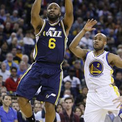 Utah Jazz's Jamaal Tinsley (6) shoots over Golden State Warriors' Jarrett Jack (2) during the first half of an NBA basketball game, Sunday, April 7, 2013, in Oakland, Calif. 