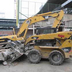 Removing debris near the left-field corner
