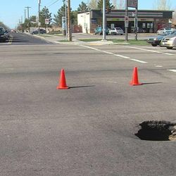 A sinkhole measuring 3-feet wide and 20-feet deep opened up in the intersection of 5400 South and 3200 West in Taylorsville just before 5 p.m. April 26, 2013.