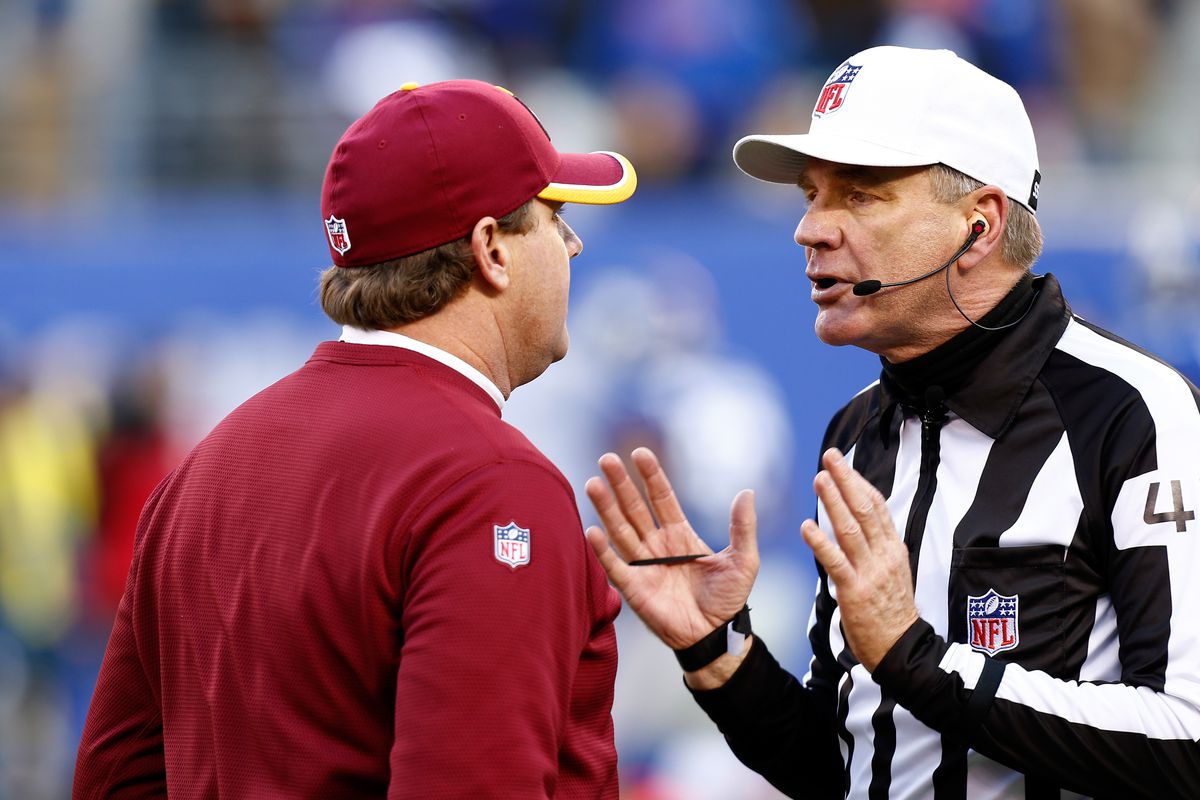 Jeff Triplette and Washington coach Jay Gruden discussing the end-of-the-half fumble by RGIII
