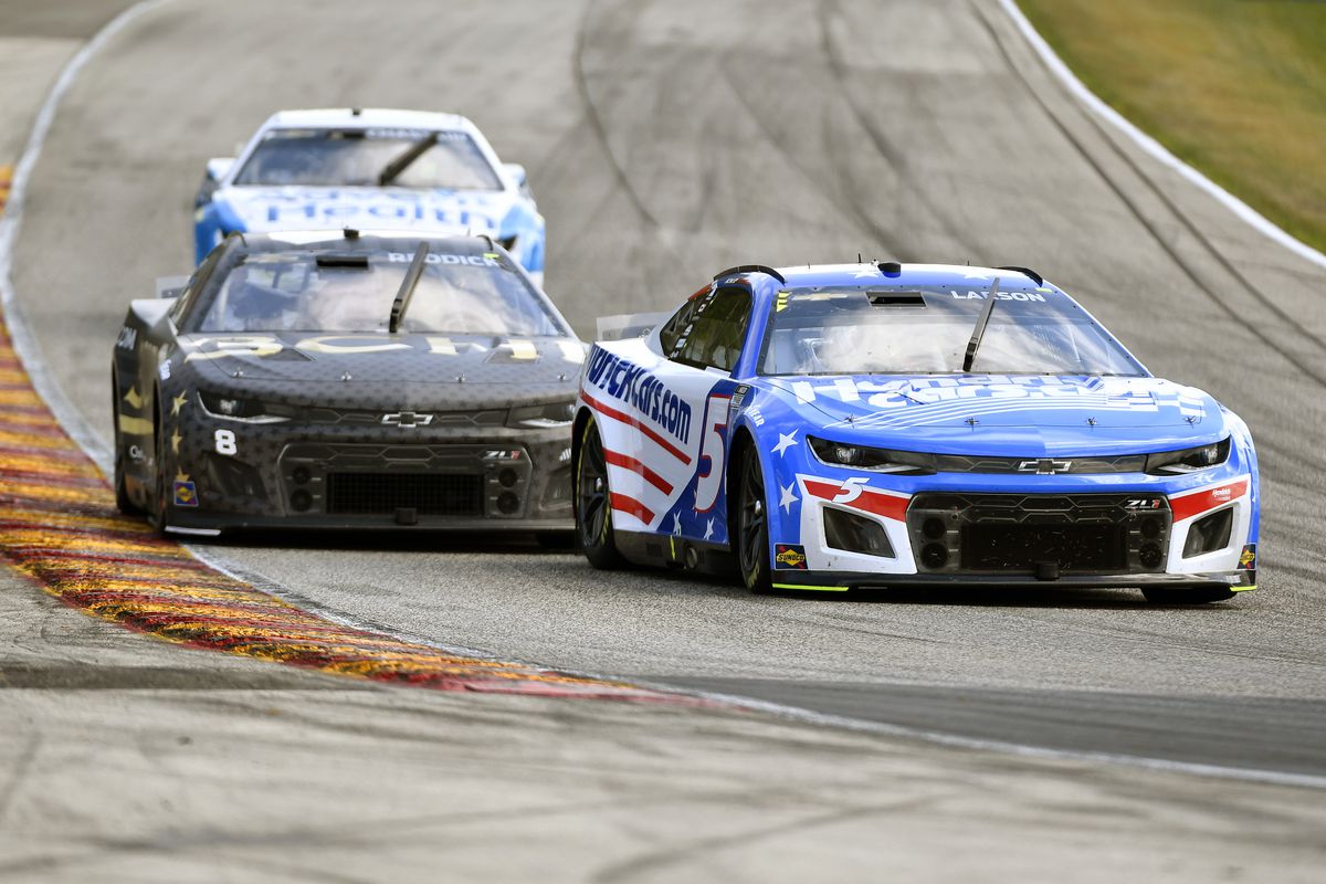 Kyle Larson, driver of the #5 HendrickCars.com Chevrolet, and Tyler Reddick, driver of the #8 3CHI Chevrolet, race during the NASCAR Cup Series Kwik Trip 250 at Road America on July 03, 2022 in Elkhart Lake, Wisconsin.