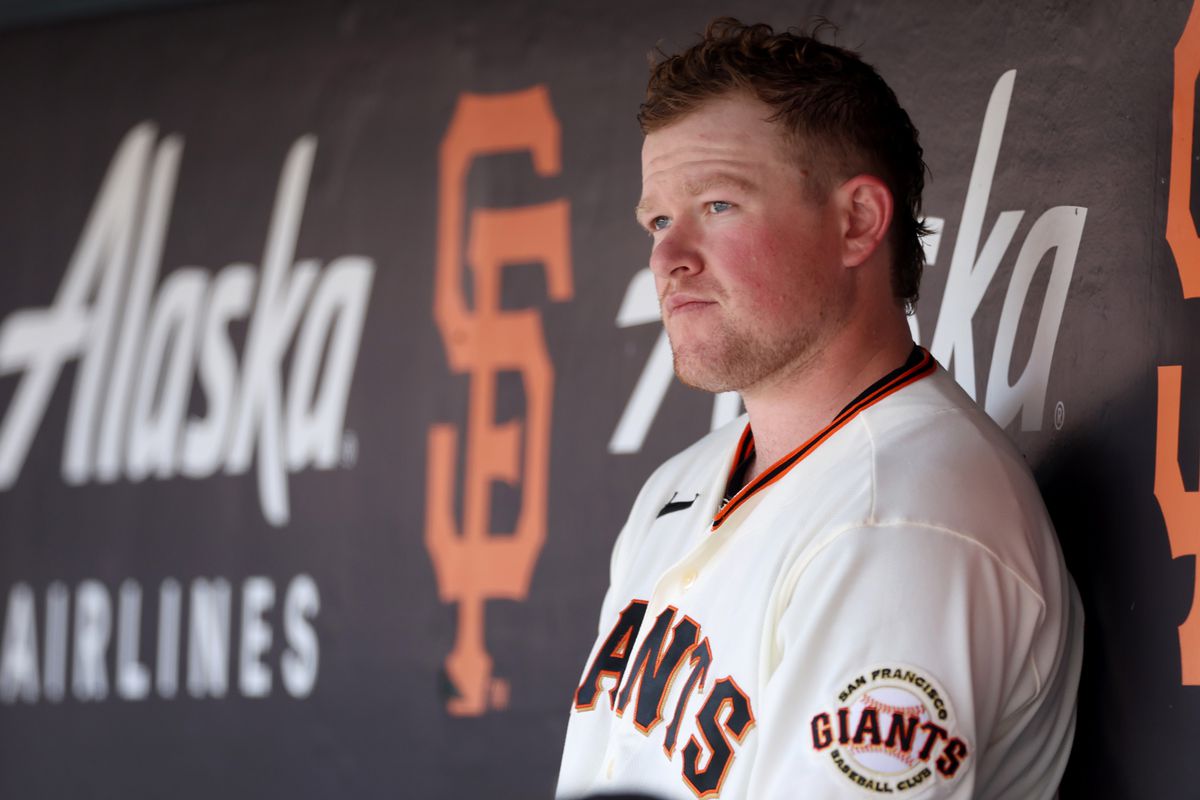 Logan Webb of the San Francisco Giants sits in the dugout during their game against the St. Louis Cardinals at Oracle Park on April 27, 2023 in San Francisco, California.