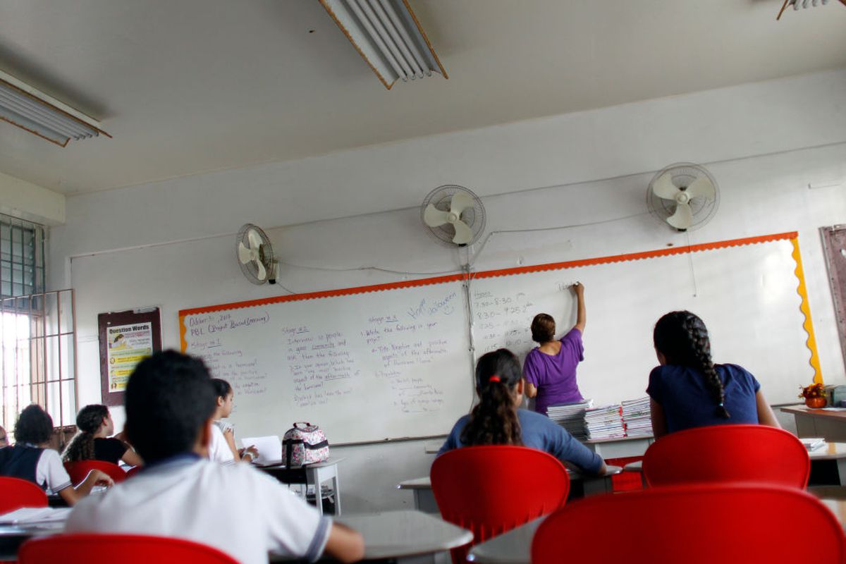 Joan Rodriguez teaches English class to her 6th grade students at the Sotero Figueroa Elementary School in San Juan, Puerto Rico, November 6, 2017.The school reopened its doors without electricity to receive students 46 days after Hurricane Maria hit the island. (RICARDO ARDUENGO/AFP/Getty Images)