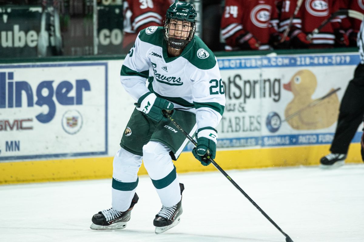 Bemidji State forward Clair DeGeorge (#26) carries the puck during a game against St. Cloud State.