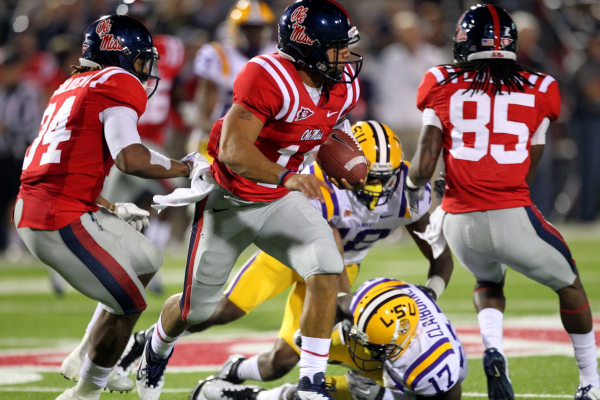 OXFORD, MS - NOVEMBER 19: Barry Brunetti #11 of the Ole Miss Rebels runs with the ball against Morris Claiborne #17 of the LSU Tigers on November 19, 2011 at Vaught-Hemingway Stadium in Oxford, Mississippi.  (Photo by Joe Murphy/Getty Images)