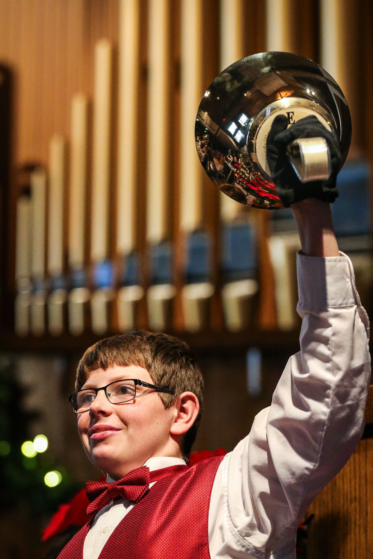 Barrett Carpenter, 14, performs with The Wesley Bell Ringers at Christ United Methodist Church in Salt Lake City on Sunday, Dec. 16, 2018.