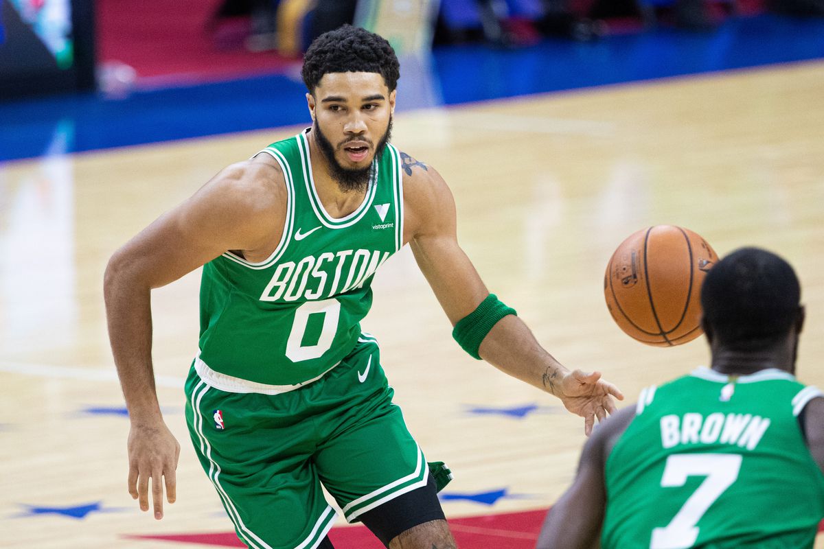 Boston Celtics forward Jayson Tatum passes the ball to guard Jaylen Brown against the Philadelphia 76ers during the first quarter at Wells Fargo Center.&nbsp;