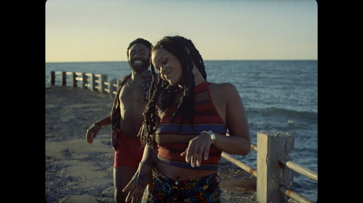 Deni (Glover) and Kofi (Rihanna) dancing to “Summertime Magic.”