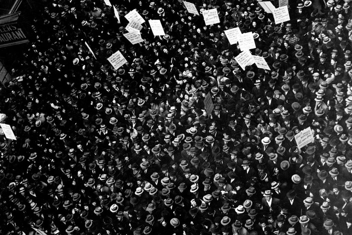 black and white crowd with signs