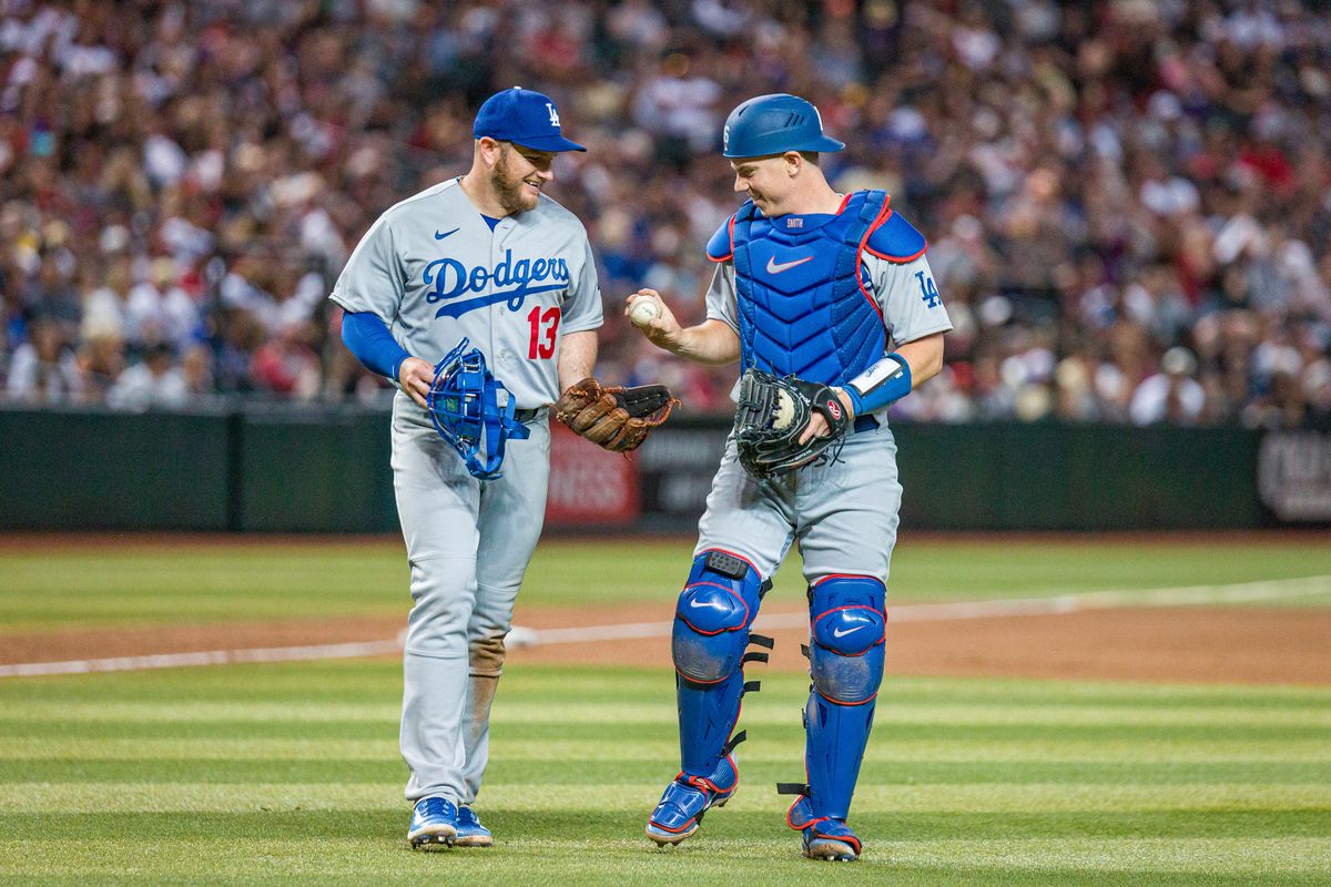 Los Angeles Dodgers third baseman Max Muncy and Los Angeles Dodgers catcher Will Smith share laugh during the MLB baseball game between the Los Angeles Dodgers and Arizona Diamondbacks on April 6, 2023 at Chase Field in Phoenix, AZ.