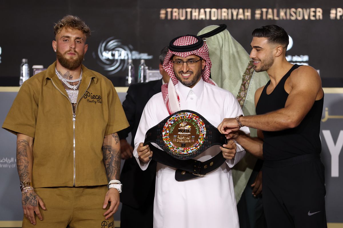 Jake Paul and Tommy Fury (R) pose for a photo with the WBC Diriyah Champion belt during the Jake Paul v Tommy Fury Press Conference on February 23, 2023 in Riyadh, Saudi Arabia.