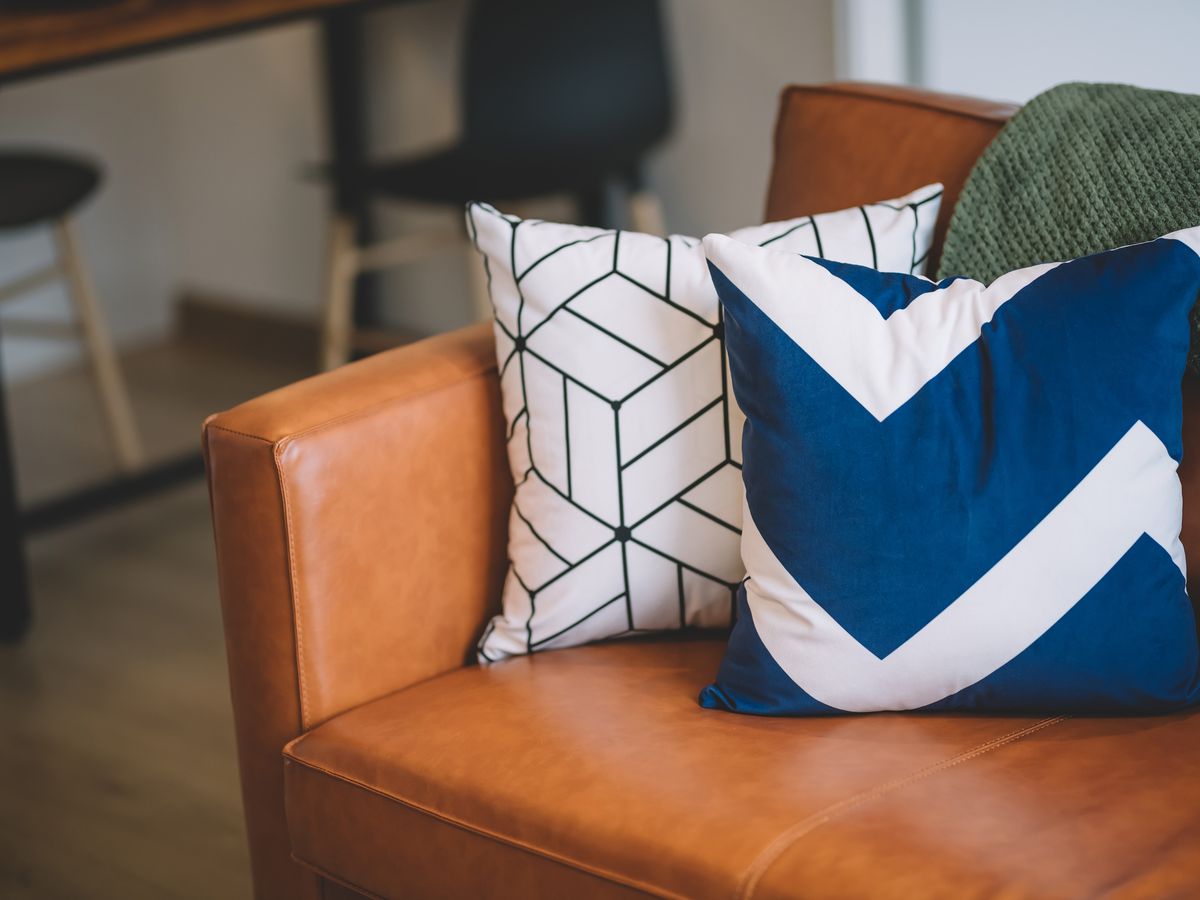 Throw pillows on couch in living room at home