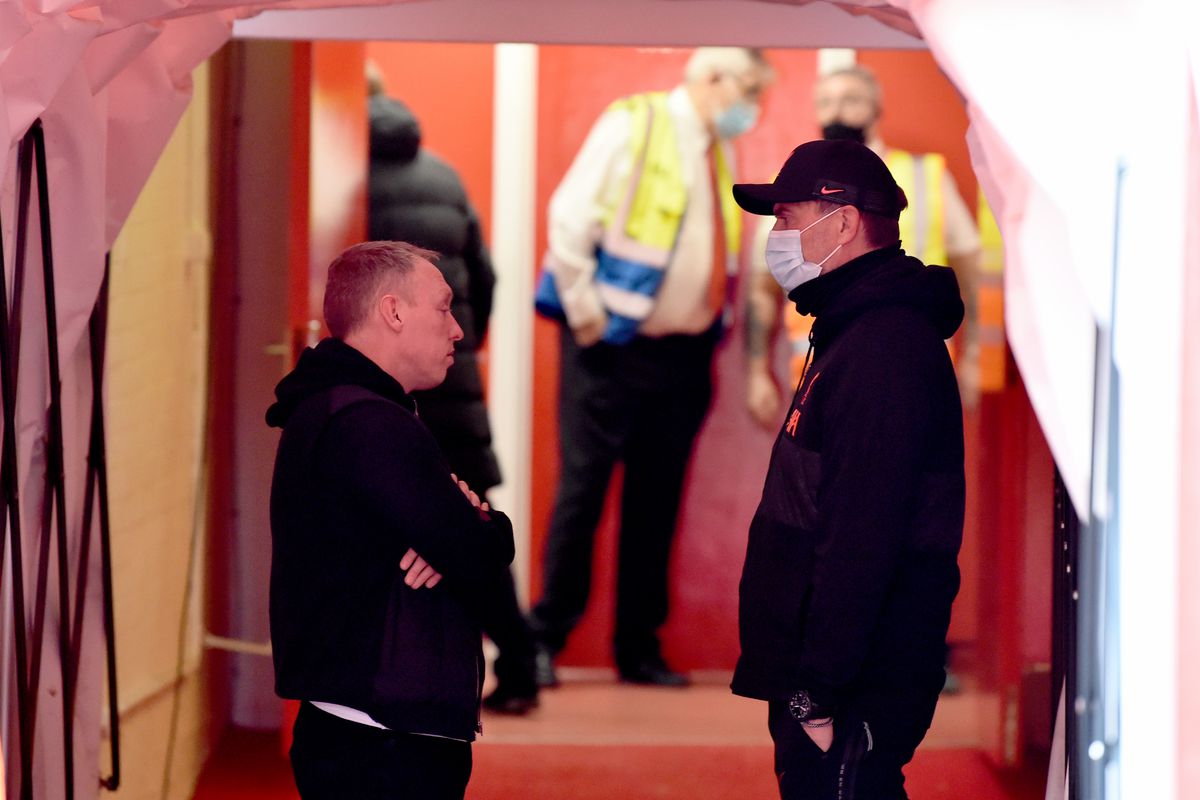 Jurgen Klopp manager of Liverpool with Steve Cooper Manager of Nottingham Forest before the Emirates FA Cup Quarter Final match between Nottingham Forest and Liverpool at City Ground on March 20, 2022 in Nottingham, England.