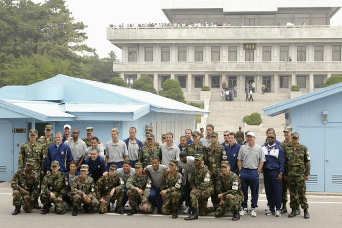 The USA soccer team poses for photographers in the Joint Security Area near the line between North Korea and South Korea on a tour of the DMZ on May 31, 2002 during preparations for the World Cup at Camp Bonifas in Pan Mun Jom in South Korea.