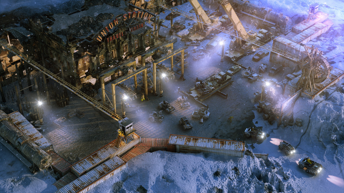 An isometric view of a wintry compound with trucks leaving it in the video game Wasteland 3